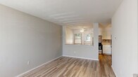 Located at 5398 Rockingham Ct in Westerville, Ohio, this multi-level home offers two bedrooms, one bathroom, and a functional layout spread across three floors. The entry level features a bright, open living area with light-toned hardwood-style flooring, neutral walls, and natural light streaming through blinded windows — creating a clean, welcoming atmosphere. The kitchen and living room share the main level in an open-concept arrangement. The kitchen is well-appointed with white shaker-style cabinetry, granite-look countertops, a mosaic tile backsplash, stainless steel appliances including a gas range and refrigerator, and matching hardwood-style flooring that ties the space together seamlessly. Both bedrooms are carpeted and feature ceiling fans, neutral walls, and closet access, offering a comfortable and quiet retreat. The primary bedroom provides a generous amount of space. The full bathroom is finished in white with a tub-shower combination, wood-look flooring, a vanity, and a large mirror. Staircases connect the three levels, making use of every available square foot efficiently. The home's consistent neutral palette and updated finishes throughout give it a clean, move-in-ready feel.