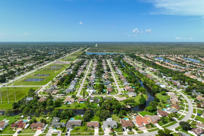Organized and lush green spaces around the residential areas in Royal Palm Beach.