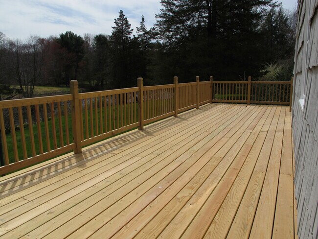 Deck overlooking yard and pond - 106 Wildwood Rd