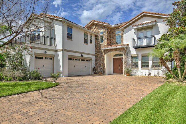 Building Photo - Stunning 4/5 Executive Pool Home in the Guard-Gated Golf Course Community of Eagle Creek - Orlando!