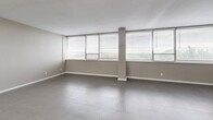 Located at 2511 Wedglea Dr in Dallas, TX, this single-story, 3-bedroom, 2-bathroom home offers a well-designed layout with a clean, modern aesthetic. The open-concept kitchen and living area serves as the heart of the home, featuring crisp white shaker cabinetry, granite countertops, a tile backsplash, and a full suite of stainless steel appliances including a dishwasher, range, and over-the-range microwave. A peninsula with bar seating provides additional prep space and casual dining. The bedrooms are generously proportioned, each benefiting from large windows that invite abundant natural light and offer exterior views. The primary bedroom provides a comfortable and private retreat with ample space. Both bathrooms are finished with granite-topped white vanities, undermount sinks, and stylish tile flooring, maintaining a consistent, contemporary look throughout. Two hallways connect the rooms efficiently, contributing to a logical and functional floor plan. Neutral taupe walls, textured tile flooring, and clean white trim create a cohesive, move-in-ready interior. The overall ambiance is bright, understated, and modern—well-suited for comfortable everyday living in Dallas.