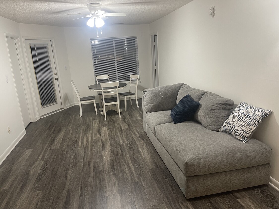 Living area and dining room - 1241 University Ct