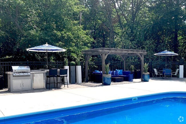 Utilize our gas grill and have a cookout by the pool. - Dunlap Falls Apartments