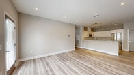 Located at 11 Lafayette Dr. in New Windsor, NY, this well-appointed 2-bedroom, 2-bathroom home offers a thoughtfully designed single-floor layout with modern finishes throughout. Light wood-look flooring flows consistently across the living spaces, complementing the neutral gray-toned walls and clean white trim.

The open-concept kitchen and living area serves as the heart of the home, featuring white shaker cabinetry, a large kitchen island with a gray quartz countertop, stainless steel appliances including a full-size refrigerator and built-in microwave, and recessed lighting overhead. The combined layout creates an inviting, functional space for everyday living.

The generously sized primary bedroom offers abundant natural light through large windows with blinds, recessed lighting, and access to a spacious walk-in closet outfitted with wire shelving. The en-suite bathroom is finished with floor-to-ceiling subway tile, a frameless glass walk-in shower with a built-in bench, and marble-look tile flooring. The second bedroom is equally well-proportioned, also featuring light wood flooring and natural light. The second bathroom includes a soaking tub with tiled surround, a dark-wood vanity with white countertop, and marble-look flooring. A dedicated in-unit laundry room with wire shelving and washer hookups adds everyday convenience.