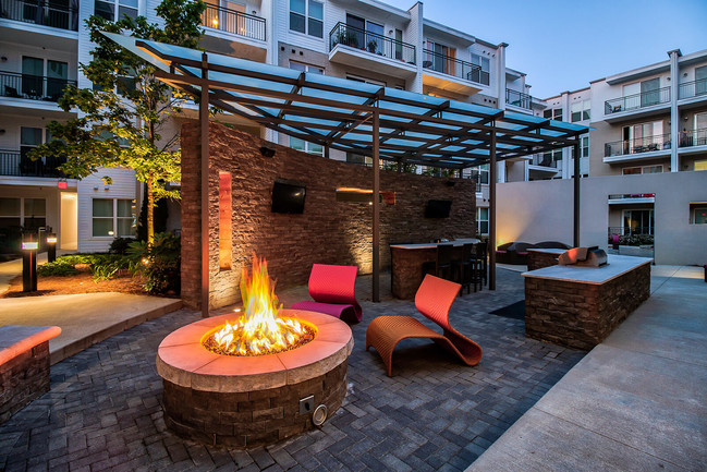 Outdoor grilling and lounge areas are located throughout the community. - Windsor Morningside