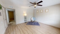 Located at 3022 North Pecan Street in Nacogdoches, TX, this single-floor, 2-bedroom, 2-bathroom home offers a well-designed and efficiently utilized layout. The living room is bright and welcoming, featuring light wood-style flooring, neutral walls, a ceiling fan with light fixture, and a large window that brings in generous natural light and outdoor views. The kitchen is thoughtfully appointed with rich dark-wood cabinetry, granite-style countertops, a double-basin sink, a gas range, and a light tile backsplash, providing ample storage and prep space. Both bedrooms are comfortably sized, with the primary bedroom offering plush carpeting, a ceiling fan, a window with outdoor views, and multiple closet doors for generous storage. The second bedroom also features soft carpeting and ceiling fan. The bathrooms are finished with elegant marble-style tile surrounds in the tub/shower, while one bathroom includes a double-vanity with dark wood cabinetry and granite countertops. A dedicated dining area, hallway, and an impressive five closets throughout the home round out the functional floor plan. The overall ambiance is clean, light, and move-in ready.