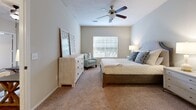 Located at 5201 Lakeland Blvd in Flowood, Mississippi, this single-story, 3-bedroom, 2-bathroom home offers a well-designed layout with thoughtful finishes throughout. The living room welcomes natural light through large windows and features rich hardwood-style flooring, creating a warm and inviting atmosphere. A hallway with built-in glass shelving connects the main living areas, adding a practical yet stylish touch.

The kitchen is well-appointed with stainless steel appliances—including a refrigerator, range, and microwave—complemented by rich dark cabinetry, granite countertops, and a tile backsplash. Tile flooring flows through the kitchen and into the adjacent dining area, which is brightened by a pendant light fixture overhead.

The spacious primary bedroom features plush carpeting, a ceiling fan, and a window that fills the room with natural light. The additional bedrooms are similarly carpeted and equipped with ceiling fans and windows, offering comfortable and functional spaces. Both bathrooms are finished with granite-topped vanities and tile flooring.

A dedicated laundry room houses a full-size washer and dryer with overhead shelving for added storage. Throughout the home, neutral tones and clean lines create a cohesive, move-in-ready aesthetic suited for comfortable everyday living.