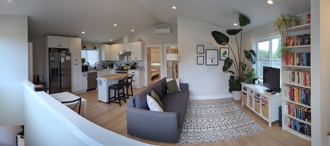 Large open living room into kitchen with central heating and cooling! - 3240 29th Ave W House