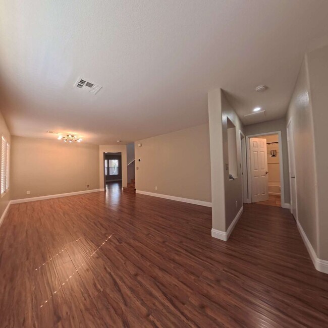 Building Photo - Stunning 2-Story Home with a Bedroom downstairs and a Backyard Oasis.