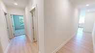 Located at 10865 Parkside Dr in Knoxville, TN, this well-appointed single-story home offers three bedrooms, two bathrooms, and a thoughtfully designed layout. The open-concept living room is a standout feature, bathed in natural light from large corner windows with blinds and French doors that lead to a private balcony overlooking lush greenery. Light-toned luxury vinyl plank flooring flows throughout the main living areas, lending a clean and modern aesthetic.

The kitchen is efficiently designed with light wood cabinetry, white subway tile backsplash, stainless steel appliances including a dishwasher, range, and microwave, plus a window above the sink that brings in additional natural light. Crown molding adds a refined touch throughout.

The bedrooms feature plush carpet, ceiling fans, and windows with views of the surrounding trees, creating a calm and comfortable atmosphere. The spacious primary bedroom connects to its own bathroom, which includes a wide vanity with light wood cabinetry, a neutral countertop, and well-lit mirror. The second bathroom is similarly appointed with a matching vanity and modern fixtures.

A dedicated laundry room houses a full-size washer and dryer with overhead wire shelving. Three closets provide ample storage throughout the home, and a central hallway connects all rooms efficiently. The overall palette of soft neutrals and natural wood tones gives the home a bright, move-in ready feel.