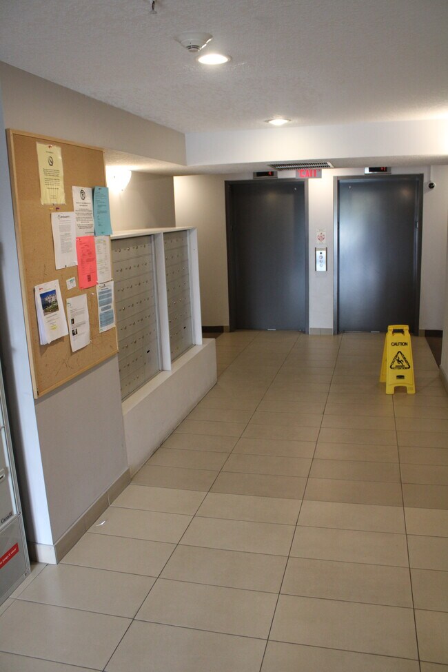 Photo du bâtiment - Cozy 1-Bedroom Main Floor Condo with Patio...
