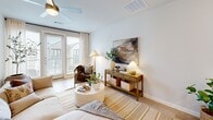 This contemporary residence in Mansfield, TX offers 1120 square feet of thoughtfully designed living space across two floors. The home boasts 2 bedrooms and 3 bathrooms, with the primary bedroom measuring a spacious 130 square feet. The first floor, encompassing 790 square feet, features an open-concept layout that seamlessly blends the kitchen and living areas. The kitchen is a chef's delight, showcasing pristine white cabinetry, stainless steel appliances, and a generous island with seating. Large windows throughout flood the space with natural light, while stylish pendant lighting adds a touch of modern elegance. The bedrooms are well-appointed, with the primary suite offering ample space and a private bathroom. All bathrooms are designed with contemporary fixtures and finishes, including glass shower enclosures and sleek vanities. Additional amenities include a single-car garage, hallway storage, and a staircase connecting both levels. The property's neutral color palette and hardwood flooring create a cohesive, inviting atmosphere throughout.