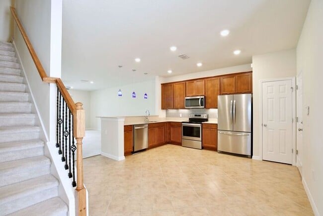 Photo - Immaculate Townhome · Dual En-Suite Bedrooms + Flex Loft · Cable & Internet Included · 3.5 Miles ...