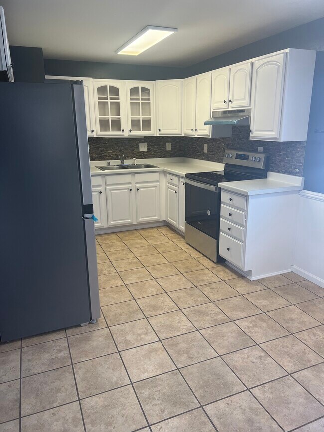 Kitchen - Brand new appliances! - 2624 S Kernan Ave