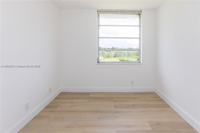 Building Photo - $2,100MONTHLY;8740 N SHERMAN CIR. #408 MIR...