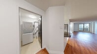 Located at 675 Richmond St in downtown London, Ontario, this well-appointed one-bedroom, one-bathroom unit offers a thoughtfully designed layout across a single floor. The open-concept kitchen and living area forms the heart of the space, with warm hardwood flooring flowing throughout the main living zones, creating an inviting and cohesive atmosphere. The kitchen is a standout feature, finished with crisp white cabinetry, dark countertops, a herringbone-patterned tile backsplash, and a full suite of stainless steel appliances including a refrigerator, stove, microwave, and dishwasher. Light tile flooring and track lighting above complete the clean, modern aesthetic. The spacious bedroom receives generous natural light through a large window offering views of the surrounding London cityscape, giving the room an airy, open feel. The bathroom is finished to a high standard, featuring large-format grey floor tiles, a white vanity with ample storage, a full-size tub-shower combination clad in classic white subway tiles, and a bright vanity mirror with elegant lighting. Additional practical spaces include a closet and a utility room, rounding out the functional offerings of this well-designed urban residence.