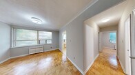 Located at 110 Marlee Ave in Toronto's vibrant Fairbank neighbourhood, this two-bedroom, one-bathroom unit offers a practical and well-organized single-floor layout. Classic parquet hardwood flooring runs throughout the living areas and both bedrooms, lending warmth and a timeless character to the space.

The primary bedroom is a comfortable size, featuring a window that brings in natural light and a radiator for heating. The second bedroom is more compact, finished with the same parquet flooring and neutral grey walls. The primary bedroom also benefits from a built-in sliding-door closet, providing convenient storage.

The kitchen is efficiently laid out with white cabinetry offering ample storage, a granite-effect countertop, a stainless steel sink, and a freestanding electric range. Tile flooring and a ceramic tile backsplash complete the functional design.

The bathroom features a full tub-shower combination surrounded by light beige ceramic wall tiles, complemented by a marble-effect vanity countertop and an integrated sink. A hallway connects the rooms, contributing to a straightforward and accessible floor plan. Overall, the unit presents a clean, functional living environment with consistent finishes throughout.