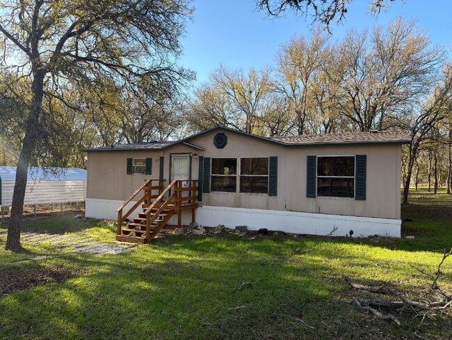Building Photo - 3 bed 2 bath on one acre lot. New vinyl flooring throughout.