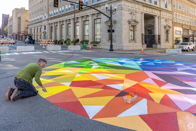Volunteer artists are revamping Downtown Huntington's public artwork.