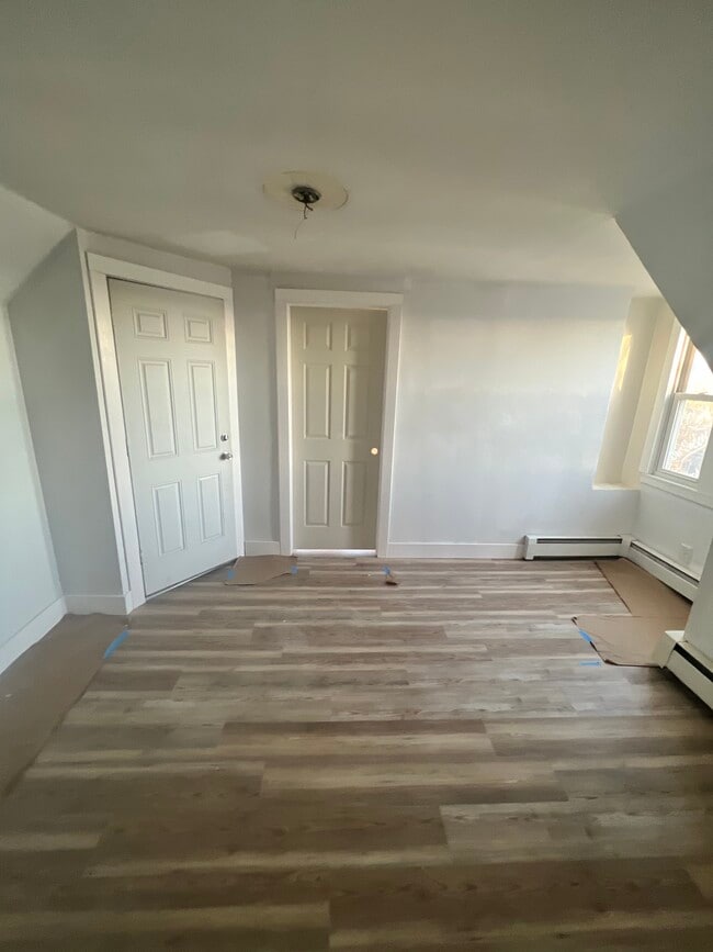 Living room/entry - apartment entry door left, room 3 right - 103 Walnut St