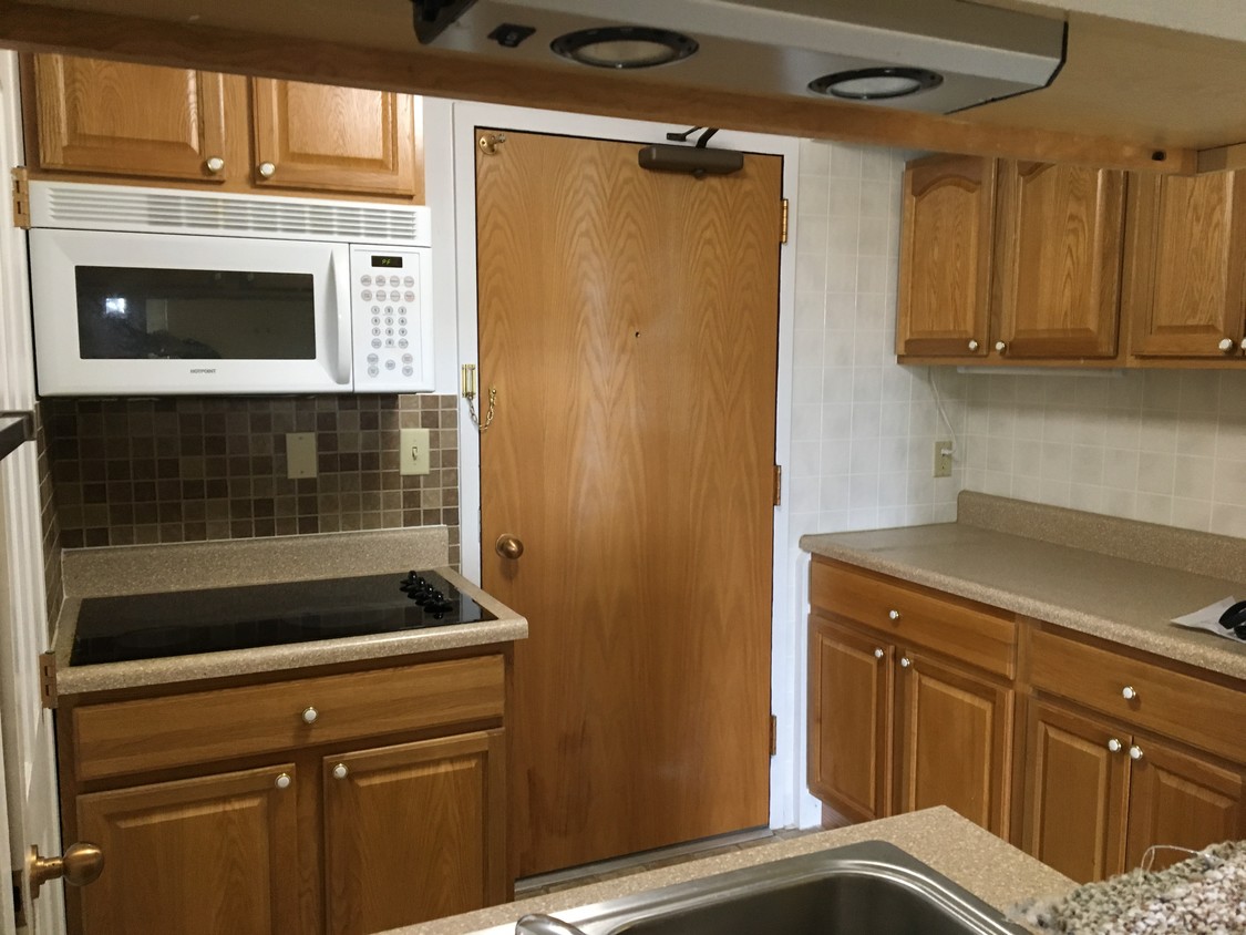 Kitchen has lots of storage and pantry closet - 5951 N Skeel Ave