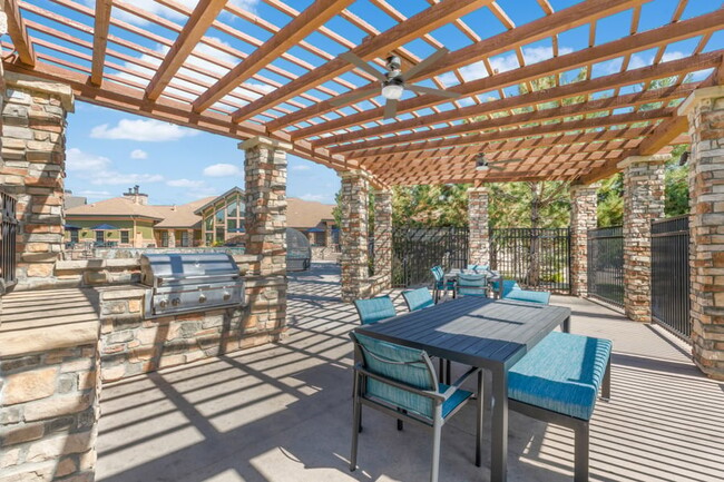 Outdoor pavilion with grills and ample seating - The Sanctuary at Tallyn's Reach Apartments