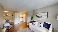 Located at 314 Great Lakes Dr in Noblesville, Indiana, this single-floor, 2-bedroom, 2-bathroom home offers a well-organized and comfortable layout. The living room serves as the heart of the home, featuring warm wood-style flooring, neutral gray walls, and a textured ceiling. Natural light filters in through a window and a glass-panel door, creating a bright and welcoming atmosphere. The kitchen, visible from the living area, features white cabinetry and white appliances, maintaining a clean and cohesive aesthetic throughout the common spaces. The spacious primary bedroom is carpeted and includes a generous walk-in closet with wire shelving, offering ample storage. A large window brings in abundant natural light, enhancing the room's comfortable scale. The second bedroom is also carpeted, with a window providing natural light and a relaxed, functional feel. Both bathrooms feature wood-style flooring, white vanity cabinetry with granite-style countertops, and neutral gray walls. One bathroom includes a stand-up shower, while the second provides a more open layout with practical fixtures. A hallway connects the bedrooms and bathrooms, keeping the layout efficient. Two closets throughout the home add further storage versatility, making this residence a practical and inviting place to call home.
