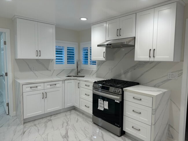 new kitchen cabinets and stove - 3241 Prospect Ave