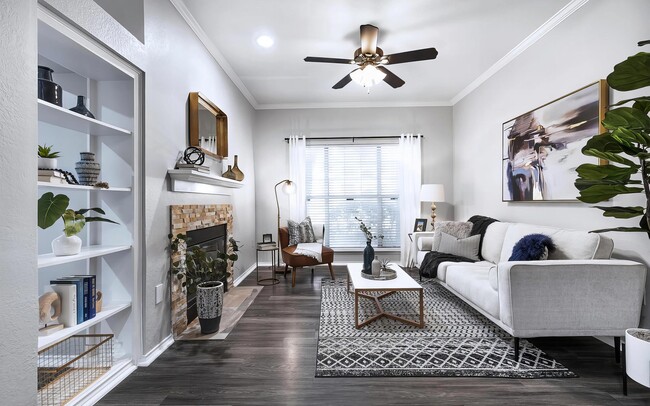 Living Room with Wood Look Vinyl Flooring Fireplace Built In Shelves and Ceiling Fan - Mesa Verde