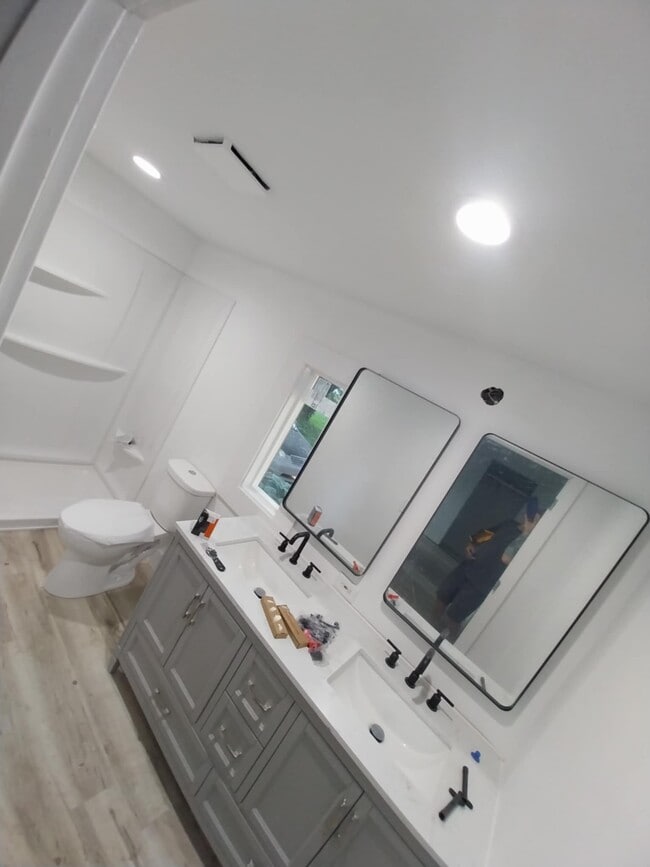 Double vanity attatched to the master with all new shower toilet and vanity - 3914 Clarnin St