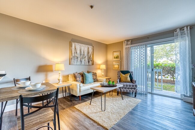 Living Room and Patio - Aventine at Lantana - 55+ Active Adult Apartments