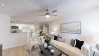 Located at 3450 Barker Cypress Rd in Houston, TX, this one-bedroom, one-bathroom residence offers a thoughtfully designed single-floor layout that maximizes every inch of its cozy footprint. The open-concept living, dining, and kitchen area forms the heart of the home, filled with natural light from large windows dressed in elegant navy drapes. Light wood-tone flooring, neutral walls, and a ceiling fan overhead give the living space a bright, airy feel. The kitchen is outfitted with white cabinetry, marble-look countertops, stainless steel appliances — including a refrigerator, range, microwave, and dishwasher — plus a pantry and convenient laundry area. The bedroom offers plush carpeting, a natural light-filled window, and access to two closets, providing ample storage. The bathroom features a white vanity with marble-look countertops, a tub-shower combination, and wood-look flooring, maintaining the clean, cohesive aesthetic found throughout the home. With its efficient layout, modern finishes, and functional amenities including dedicated dining space and in-unit laundry, this residence delivers comfortable, practical living in a well-organized and stylish package.