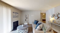 This single-story residence in Memphis, Tennessee offers a well-organized layout across two bedrooms and one and a half bathrooms. The living room serves as the central gathering space, featuring carpet flooring, a textured ceiling, a wood-burning fireplace, and a sliding glass door framed by vertical blinds that allows natural light to fill the room and provides access to an outdoor patio area. A small dining or breakfast bar area is positioned nearby, offering a casual spot for meals.

The primary bedroom includes carpet flooring, a ceiling fan, and an en-suite half bathroom, providing added privacy and convenience. The second bedroom also features carpet, a ceiling fan with light fixture, a window for natural light, and a walk-in closet with built-in shelving for ample storage.

The full bathroom is finished with tile flooring, a tub-shower combination with tile surround, and a vanity with mirror. A dedicated utility room houses a full-size washer and dryer alongside wood cabinetry, a sink, a dishwasher, and tile flooring, effectively doubling as an additional functional space. Throughout the residence, neutral tones and practical finishes create a cohesive and functional living environment.