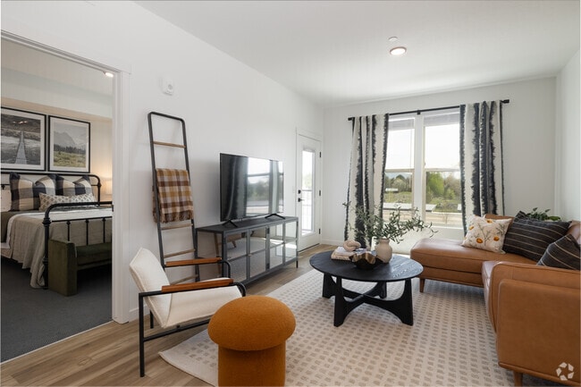 2 habitaciones, 2 baños - 1100 pies cuadrados - Sala de estar - Village Apartments