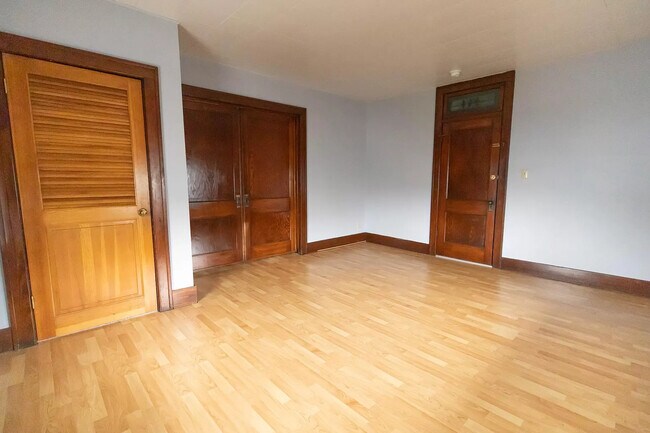 Main bedroom 17 x 14. Nice size closet, and working (original) pocket doors. (pic 2 of 2) - 700 1/2 Morgantown Ave