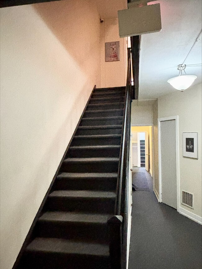 First Floor Staircase - 1009 Madison St Apartments