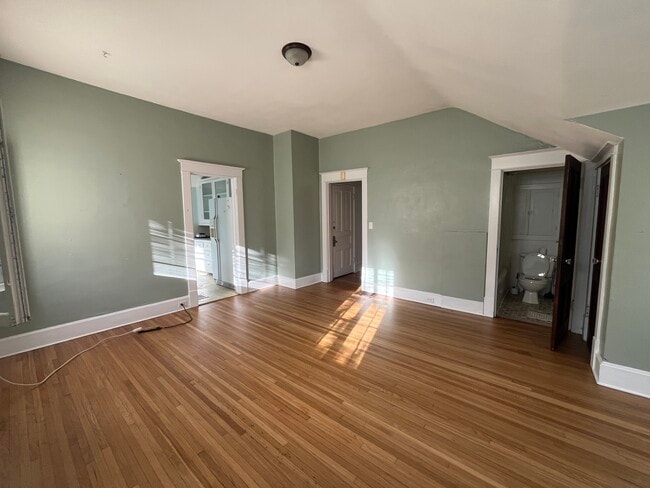 Another view of the family room. The bathroom door is seen on the right. - 1521 South Center Street