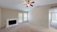 Located in DeSoto, TX, this single-story, 2-bedroom, 1-bathroom home offers a well-organized layout with a comfortable and functional design. The living and dining area is an inviting, open space highlighted by soaring vaulted ceilings, a ceiling fan with light kit, and a classic brick-surround wood-burning fireplace. Natural light pours in through multiple windows and a glass patio door, creating a bright and airy ambiance. Soft carpet flooring flows throughout the main living areas and bedrooms.

The galley-style kitchen is efficiently designed with white cabinetry featuring modern black hardware, light stone countertops, wood-look flooring, and stainless steel appliances including a refrigerator and dishwasher. The combined dining and living space connects seamlessly to the kitchen for easy everyday living.

The spacious primary bedroom includes a ceiling fan, a patio door with access to outdoor space, and a mirrored sliding-door closet. The second bedroom offers similar comfort with its own ceiling fan and natural light. The full bathroom is well-appointed with white cabinetry, stone-look countertops, a framed mirror, and a tub/shower combo. A dedicated laundry nook with washer hookups and a storage shelf adds everyday convenience. Two separate patio areas and four closets round out this efficiently designed home.