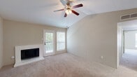 Located in DeSoto, TX, this single-story, 2-bedroom, 1-bathroom home offers a well-organized layout with a comfortable and functional design. The living and dining area is an inviting, open space highlighted by soaring vaulted ceilings, a ceiling fan with light kit, and a classic brick-surround wood-burning fireplace. Natural light pours in through multiple windows and a glass patio door, creating a bright and airy ambiance. Soft carpet flooring flows throughout the main living areas and bedrooms.

The galley-style kitchen is efficiently designed with white cabinetry featuring modern black hardware, light stone countertops, wood-look flooring, and stainless steel appliances including a refrigerator and dishwasher. The combined dining and living space connects seamlessly to the kitchen for easy everyday living.

The spacious primary bedroom includes a ceiling fan, a patio door with access to outdoor space, and a mirrored sliding-door closet. The second bedroom offers similar comfort with its own ceiling fan and natural light. The full bathroom is well-appointed with white cabinetry, stone-look countertops, a framed mirror, and a tub/shower combo. A dedicated laundry nook with washer hookups and a storage shelf adds everyday convenience. Two separate patio areas and four closets round out this efficiently designed home.
