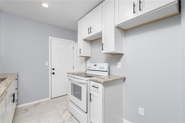 kitchen with back door and garage entry - 4038 Wabash Ave