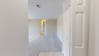Located at 700 Heritage Ln in Bel Air, Maryland, this two-bedroom, two-bathroom single-floor residence offers a practical and well-organized layout. The entrance leads into a hallway that connects the main living areas, including a carpeted living room and an adjacent dining room, both finished with neutral-toned walls and clean white trim that create a bright, cohesive atmosphere throughout.

The kitchen features warm oak cabinetry with arched door detailing, ample upper and lower storage, light-toned countertops, and tile flooring. White appliances including a range, over-the-range microwave, dishwasher, and refrigerator are included. A window over the sink brings in natural light.

Both bedrooms are carpeted and finished in soft neutral tones. The spacious primary bedroom features a window overlooking the outdoors and generous closet space. The second bedroom also includes a closet and is well-suited for guests or a home office. In total, four closets are distributed throughout the home, providing excellent storage.

The two bathrooms are clean and functional — one features a white vanity with mirrored medicine cabinet and a glass-door walk-in shower, while the second includes a full tub-shower combination with tiled surround. A dedicated laundry area adds further convenience to this well-rounded residence.