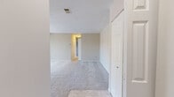 Located at 700 Heritage Ln in Bel Air, Maryland, this two-bedroom, two-bathroom single-floor residence offers a practical and well-organized layout. The entrance leads into a hallway that connects the main living areas, including a carpeted living room and an adjacent dining room, both finished with neutral-toned walls and clean white trim that create a bright, cohesive atmosphere throughout.

The kitchen features warm oak cabinetry with arched door detailing, ample upper and lower storage, light-toned countertops, and tile flooring. White appliances including a range, over-the-range microwave, dishwasher, and refrigerator are included. A window over the sink brings in natural light.

Both bedrooms are carpeted and finished in soft neutral tones. The spacious primary bedroom features a window overlooking the outdoors and generous closet space. The second bedroom also includes a closet and is well-suited for guests or a home office. In total, four closets are distributed throughout the home, providing excellent storage.

The two bathrooms are clean and functional — one features a white vanity with mirrored medicine cabinet and a glass-door walk-in shower, while the second includes a full tub-shower combination with tiled surround. A dedicated laundry area adds further convenience to this well-rounded residence.