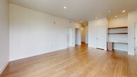 Located at 4800 Iron Gate Dr in Timnath, CO, this well-appointed 2-bedroom, 2-bathroom home offers a clean, modern aesthetic across a single thoughtfully designed floor. The open-concept living and kitchen area serves as the heart of the home, featuring warm-toned flat-front wood cabinetry, a crisp white peninsula with an undermount sink, stainless steel appliances including a side-by-side refrigerator, range, and built-in microwave, and light hardwood flooring that extends throughout the main living spaces. Recessed lighting and pendant fixtures provide a bright, welcoming ambiance. The spacious living area is bathed in natural light and connects seamlessly to the rest of the home. Both bedrooms are carpeted and generously sized, with the primary bedroom offering direct access to its own bathroom. The second bedroom includes a ceiling fan and a large window framing neighborhood views. The bathrooms are finished with wood-toned vanities, white countertops, and hardwood-style flooring. One bathroom features a glass-enclosed walk-in shower, while the other offers a tiled tub-shower combination. A dedicated closet adds practical storage. The overall design is clean and contemporary, with a neutral palette that creates a bright, inviting atmosphere throughout.