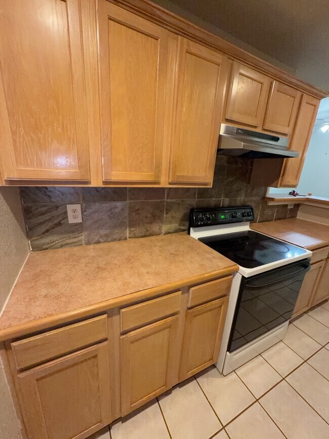Building Photo - 3/2/2 features an open and inviting living and dining area, updated wood-look flooring, and a spa...