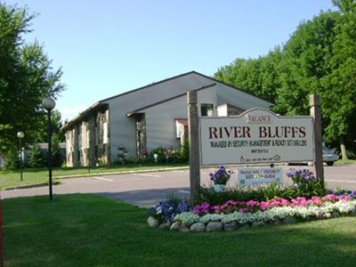 Property sign and parking lot - 200 Riverside Dr