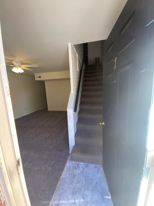 Front door entrance living room and stair leading to bedrooms and bath - 806 College Ave