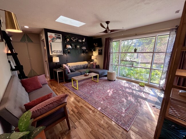 living room, nice light - 8564 N Richmond Ave