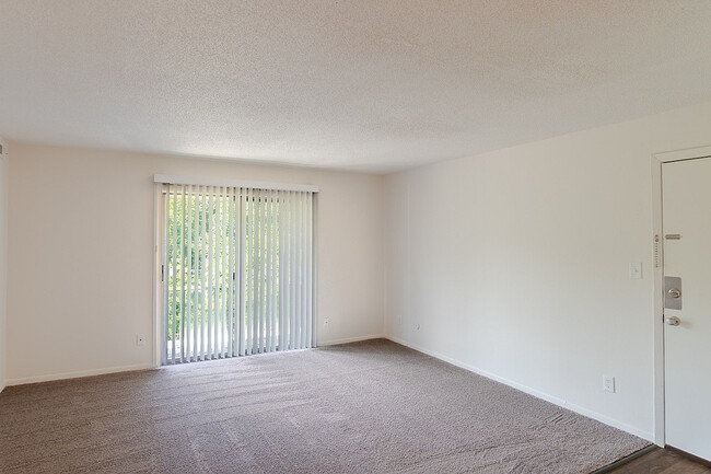 Carpeted Living Area - Rosewood Village