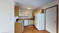 Located at 372 James Way in Marion, Ohio, this two-floor home offers a practical and well-organized layout across two levels. The kitchen is a standout functional space, featuring warm oak-toned cabinetry paired with white cabinet faces, providing generous storage both above and below the countertops. The counters are finished in a neutral laminate surface, offering ample workspace for meal preparation. Full-sized white appliances are included, featuring a gas range, dishwasher, refrigerator, and a double-basin sink positioned beneath a window. The kitchen floor is finished in light hardwood-style flooring that adds warmth to the space. Overhead lighting keeps the kitchen bright and welcoming. The two-floor layout of the home provides a natural separation between living and private areas, offering functional versatility for everyday living. The overall aesthetic throughout the home is clean and straightforward, with neutral wall tones and practical finishes that create a comfortable, livable environment. Situated in a residential area of Marion, Ohio, this home combines a well-equipped interior with a convenient location.