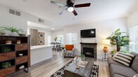 Located at 3301 Arena Blvd in Sacramento, CA, this single-story, 3-bedroom, 2-bathroom home offers a well-designed layout with modern finishes throughout. The living room serves as the heart of the home, featuring light wood-style flooring, a tile-surround fireplace, a ceiling fan, and a bright, open feel with natural light streaming through the windows. The kitchen is a standout space, outfitted with crisp white upper cabinetry, warm wood lower cabinets, a hexagonal tile backsplash, stainless steel appliances, and a large white quartz-topped island — ideal for both cooking and casual dining. The primary bedroom offers a comfortable retreat with plush carpeting, a ceiling fan, and access to natural light via a sliding glass door. The additional bedrooms are equally well-appointed, each featuring carpet flooring, ceiling fans, and windows with outdoor views. Both bathrooms maintain a clean, contemporary aesthetic — one with a walk-in shower vanity and wood-toned cabinetry, and the other with a full shower-tub combination. Light wood-style flooring flows through the common areas, tying the home's modern design together cohesively throughout.